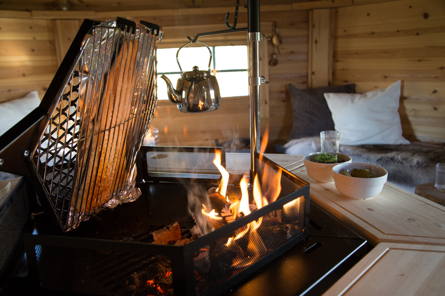 Salmon blazing on the Kota Grill inside a Grill hut.