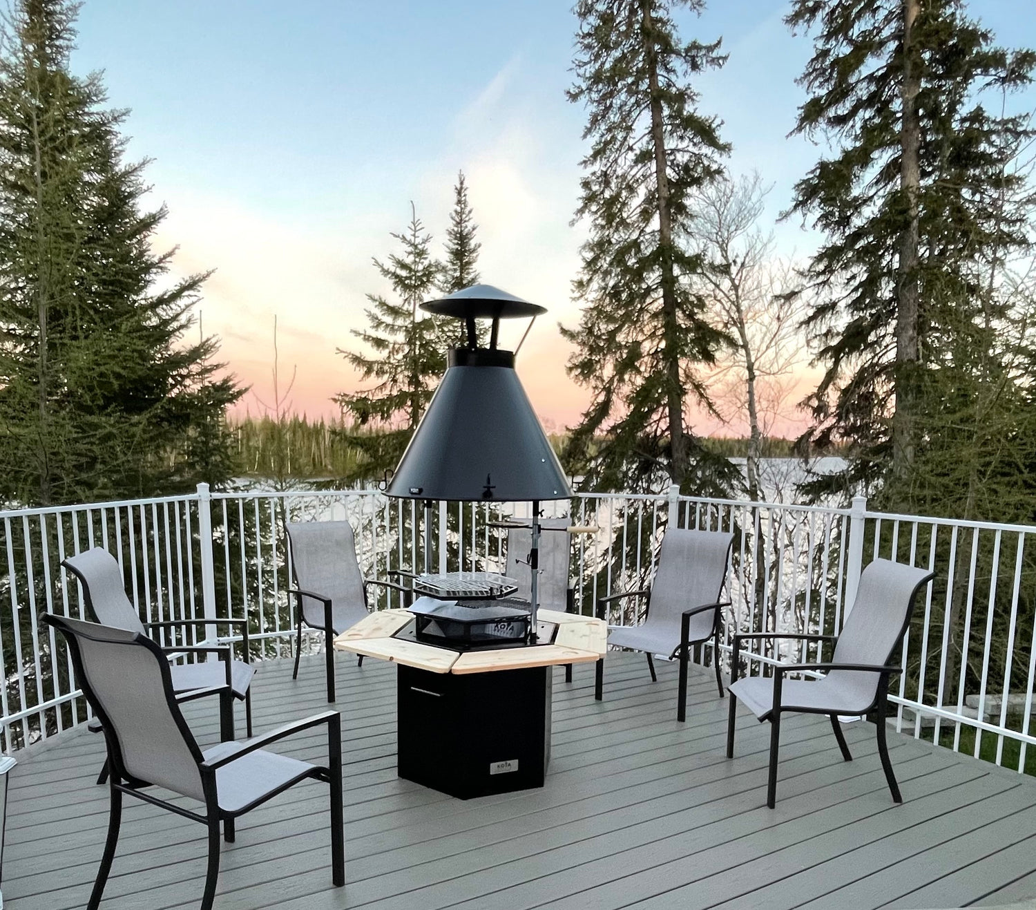 Kota Grill surrounded by chairs on a deck with a nice view